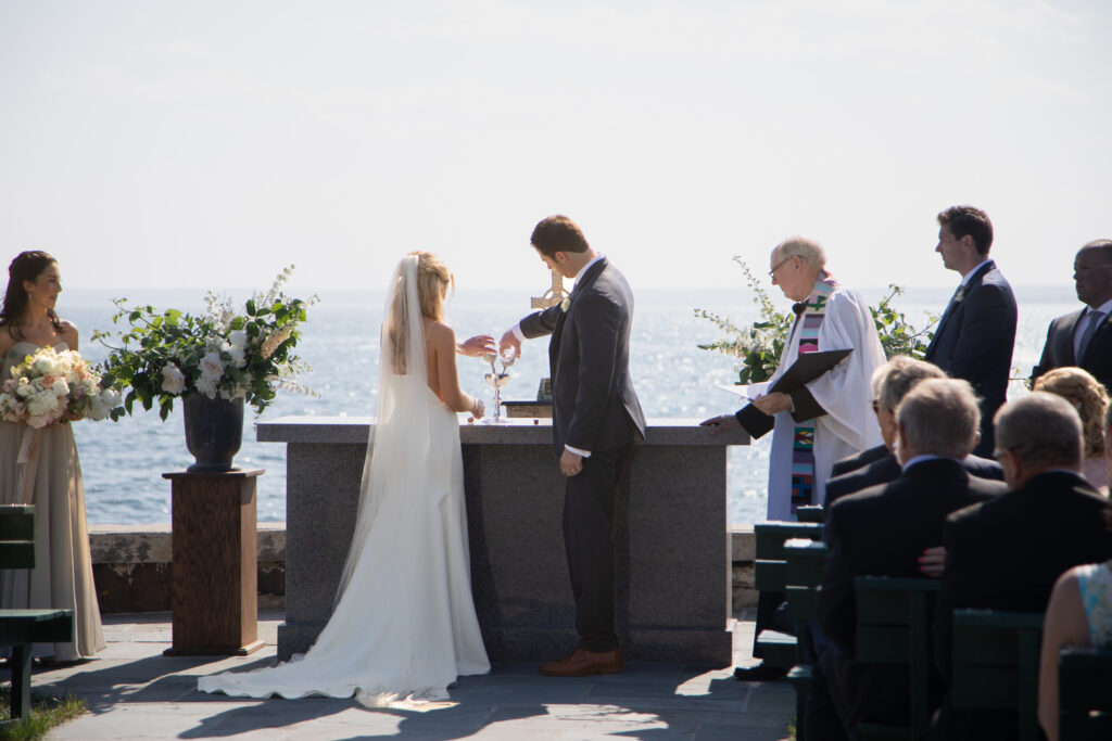 bride and groom pouring sand in together 