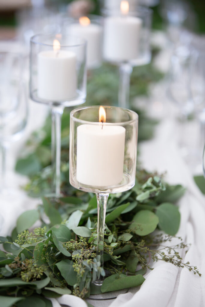 candles and greenery on tables 