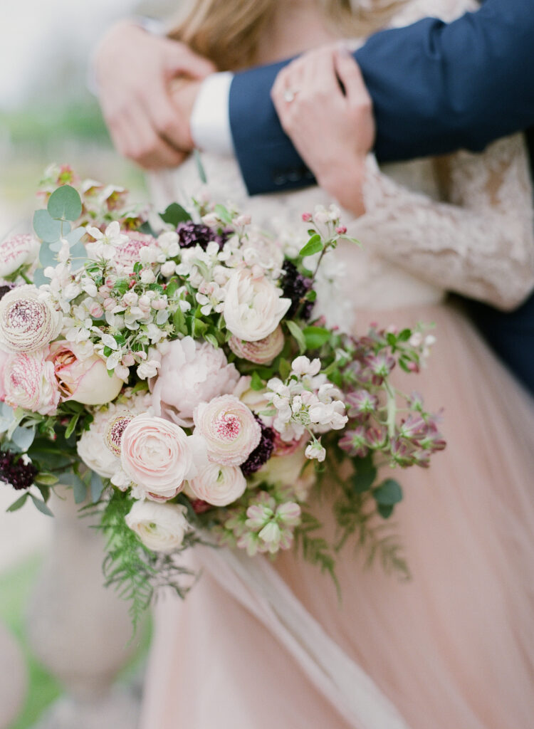 bouquet of blush and white ranunculus flowers