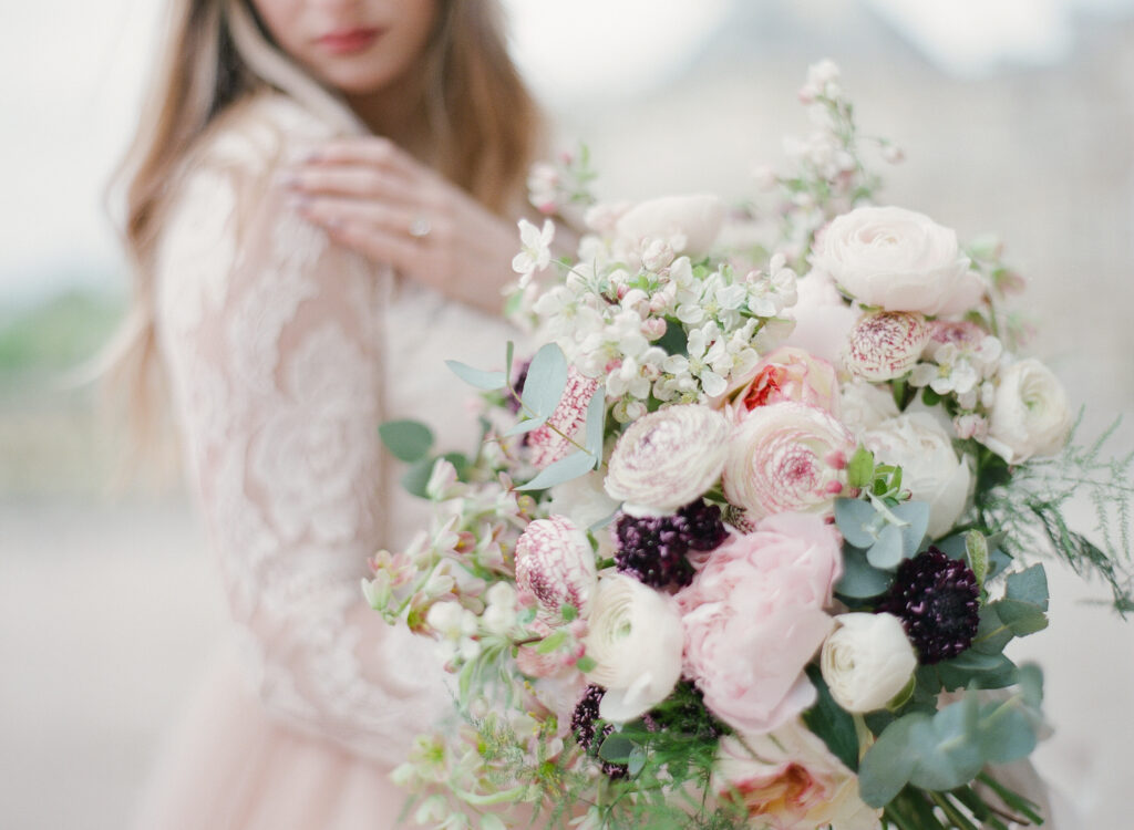 cropped image of bride with romantic blush bouquet 