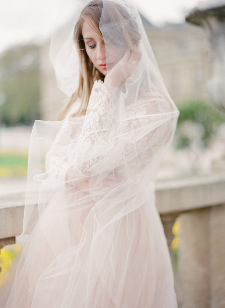 bride wrapped in cathedral veil 