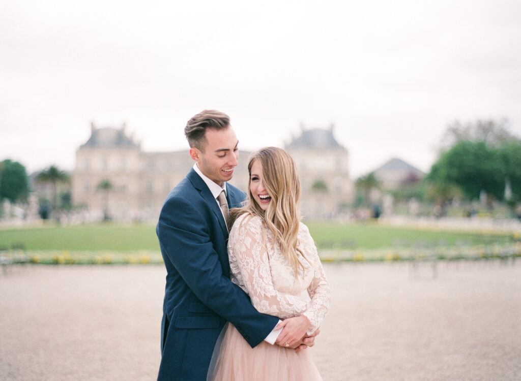 bride and groom laughing in an embrace 