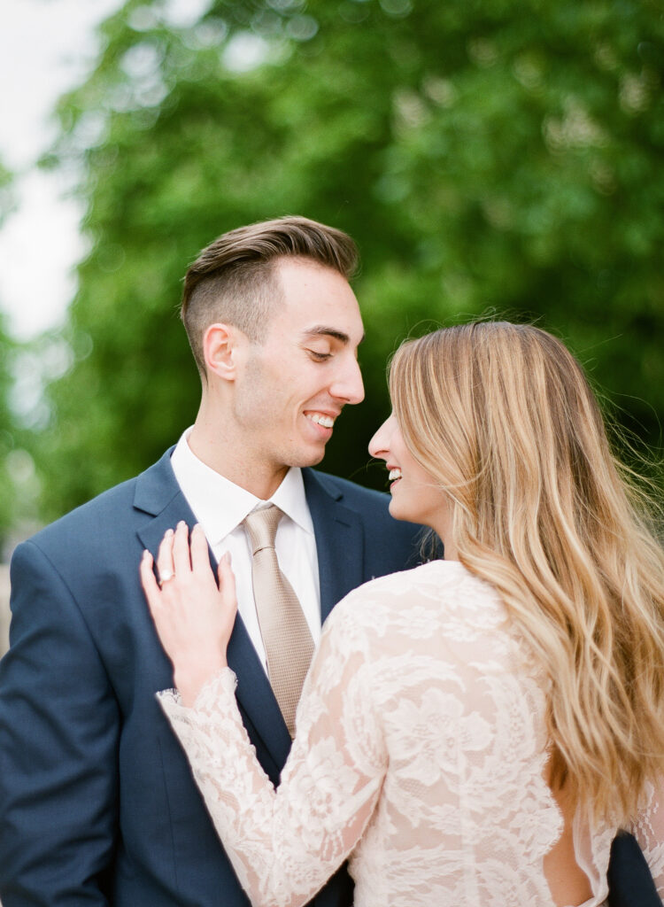 groom smiling at bride 