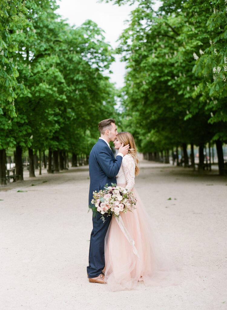 groom kissing brides forehead 