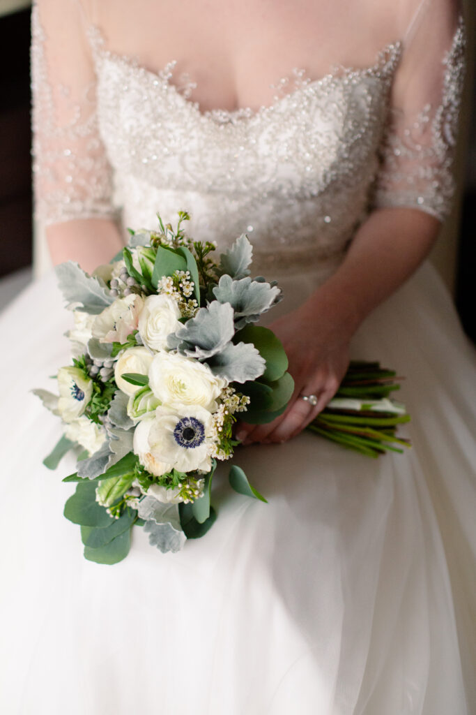 brides bouquet made from anemone flowers and lambs wool