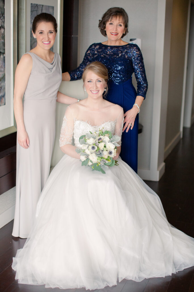 portrait of bride, her mom, and her sister before the wedding