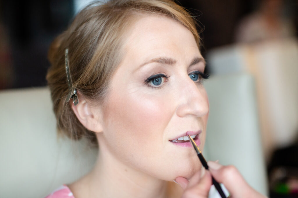 bride getting her makeup done