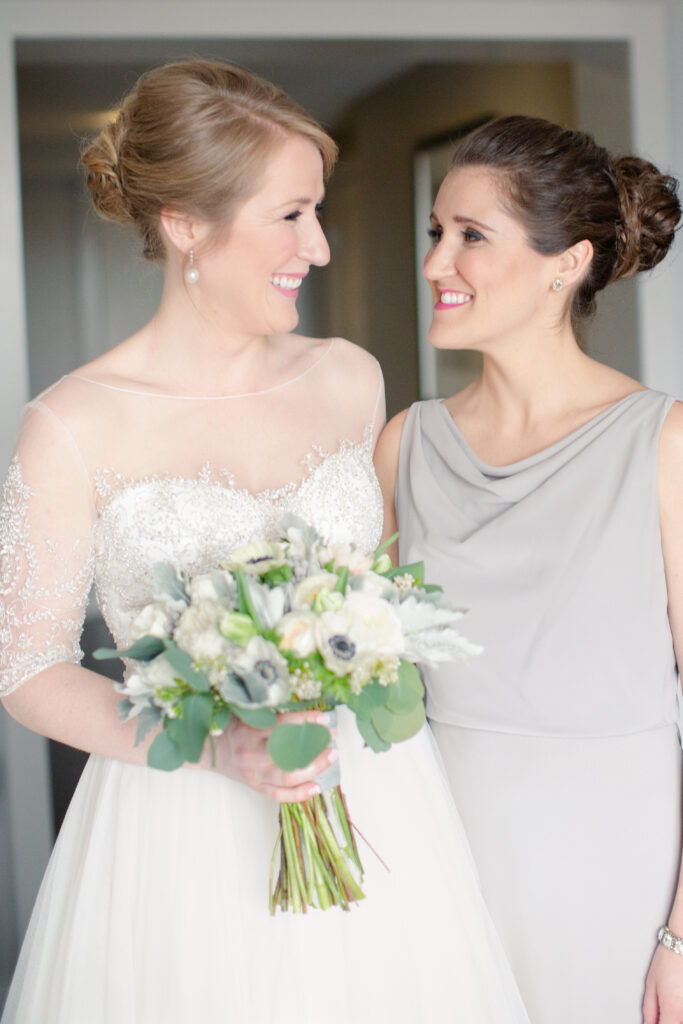 bride and sister sharing a moment 