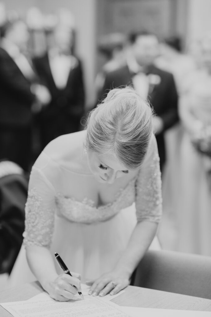 bride signing ketubah