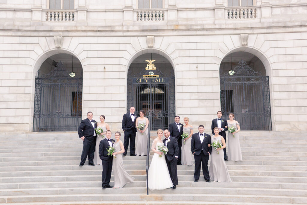 black tie wedding party in front of city hall