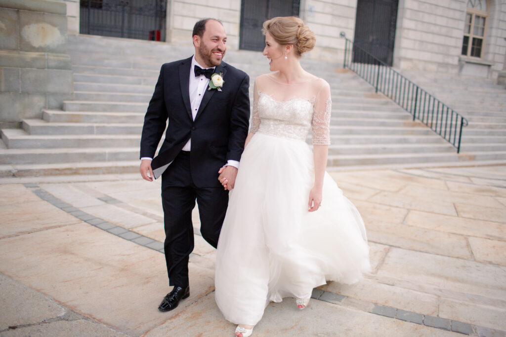 bride and groom smiling at each other