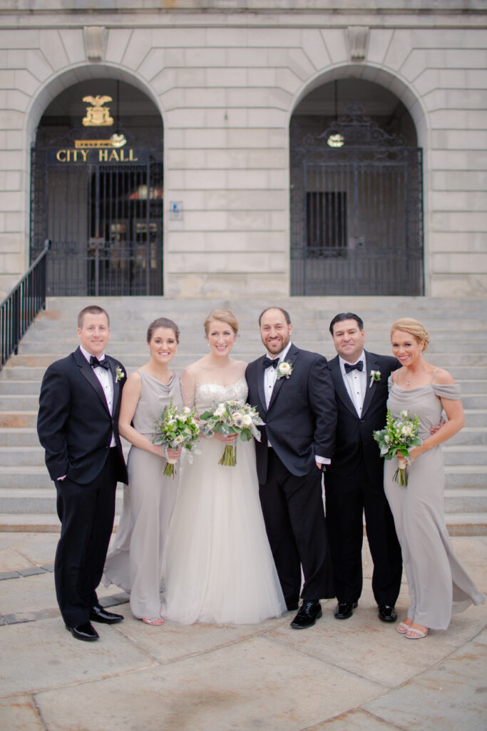 group couples portrait in front of city hall