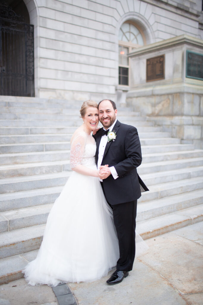 bride and groom portrait looking at the camera