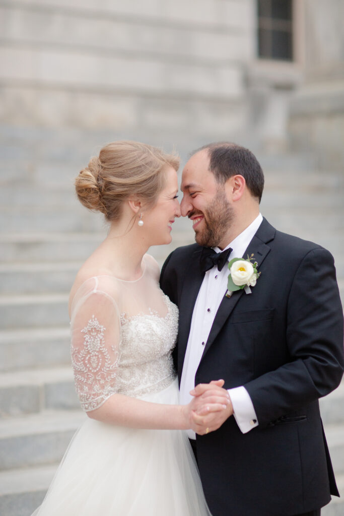 bride and groom smiling in embrace