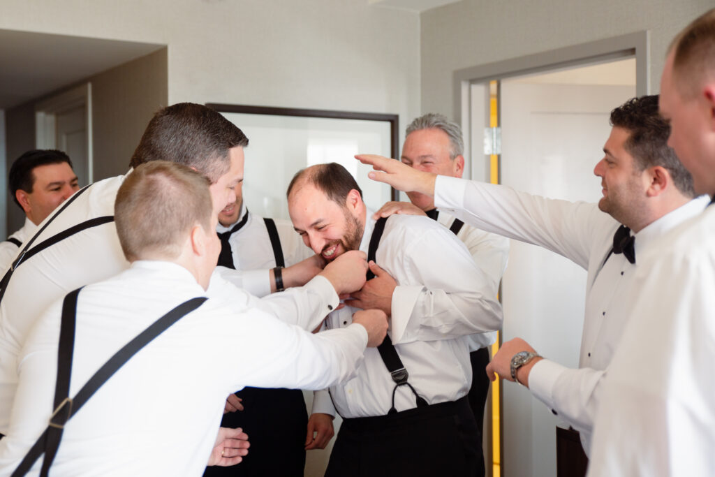 groomsmen blessing groom before wedding 