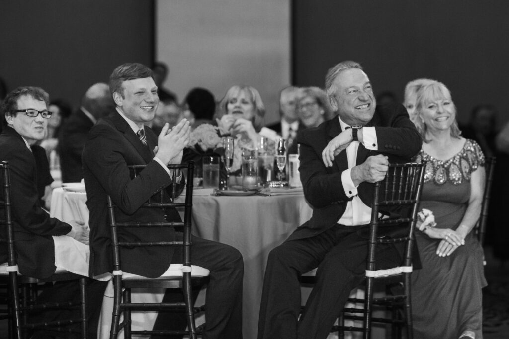 father laughing at toasts