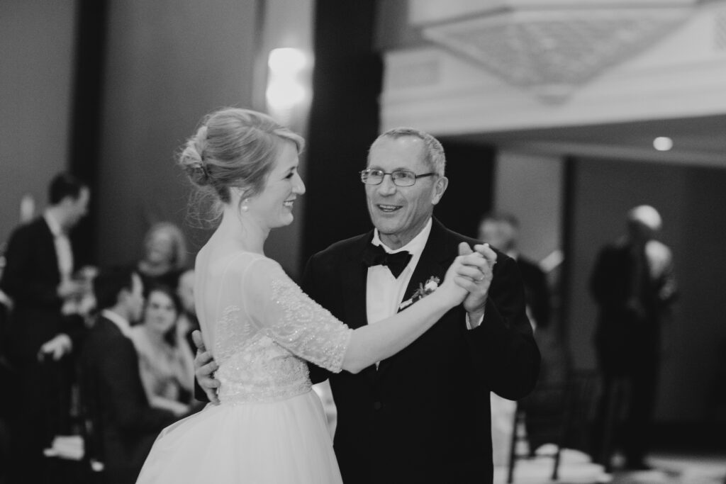 father daughter dance in black and white 