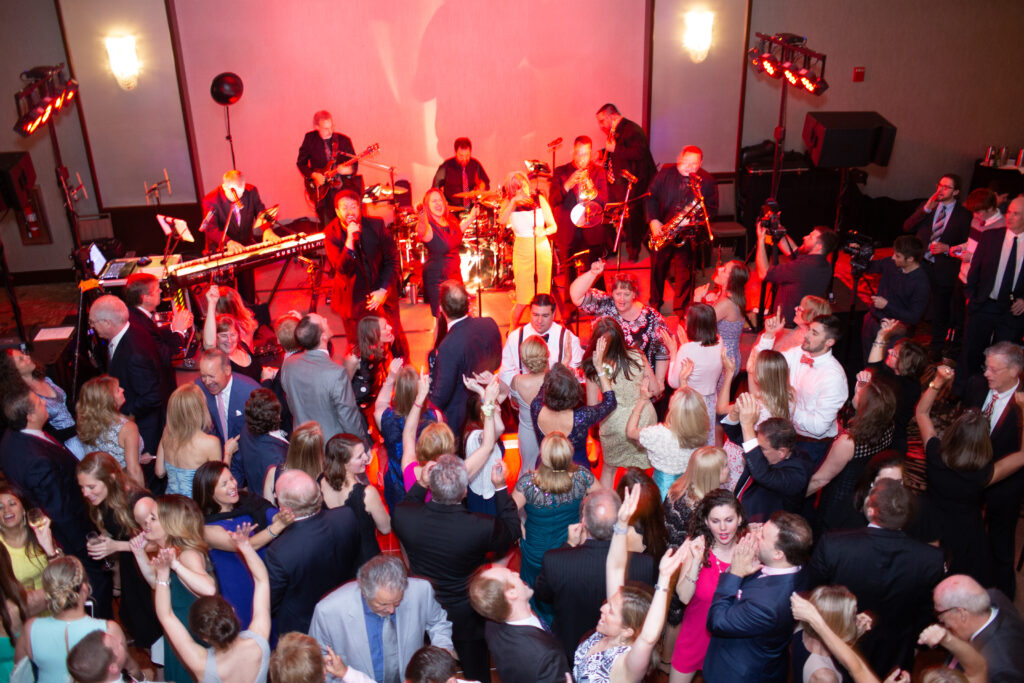 packed dance floor while band plays 